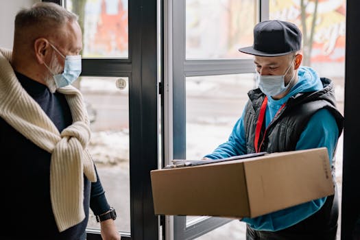 Masked delivery service during pandemic, showcasing contact-free parcel handover.