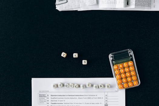 Top-down view of tax deduction items on a black background with a calculator and forms, emphasizing financial planning.